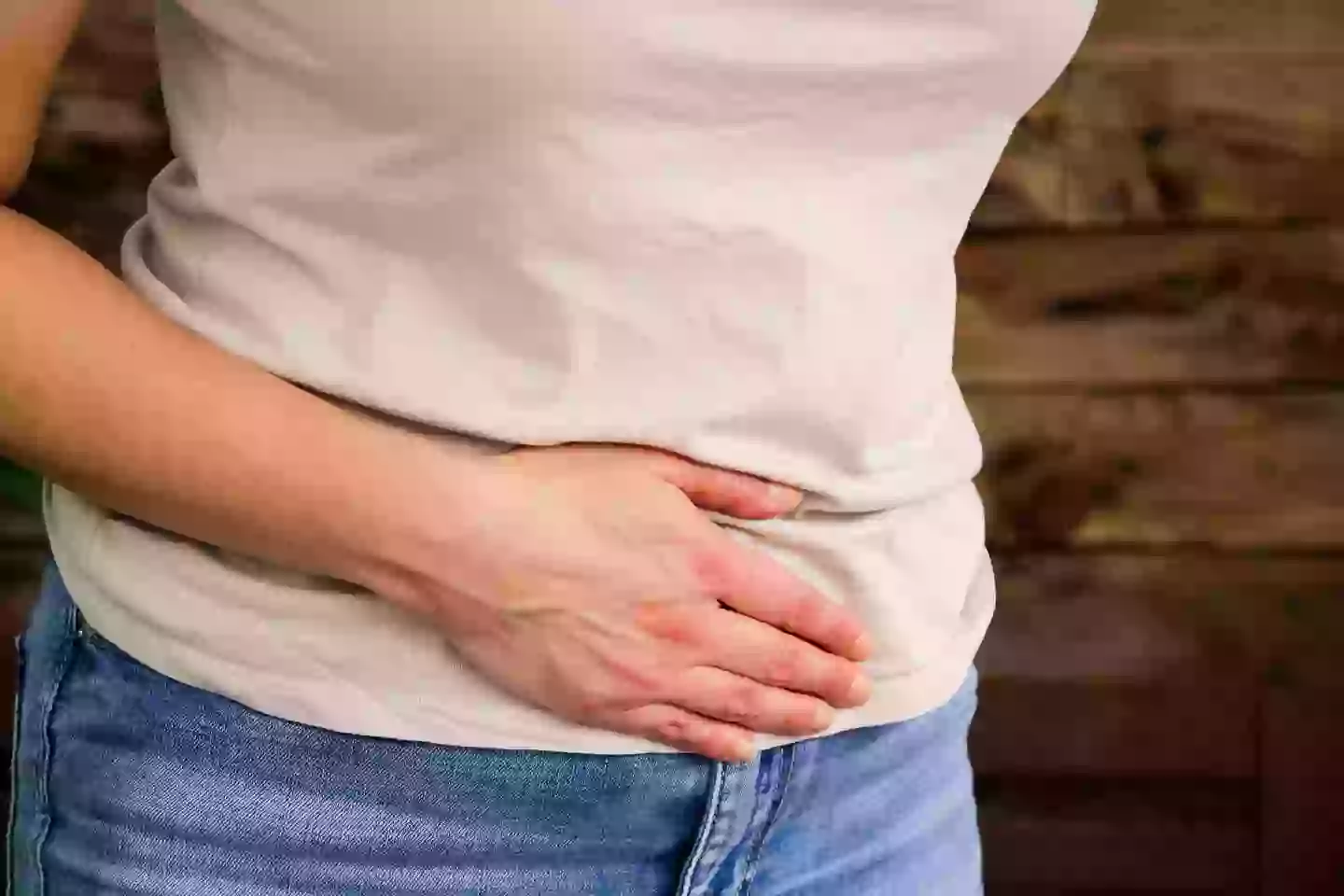 Tummy pain is one of the symptoms of bowel cancer (Getty stock images)